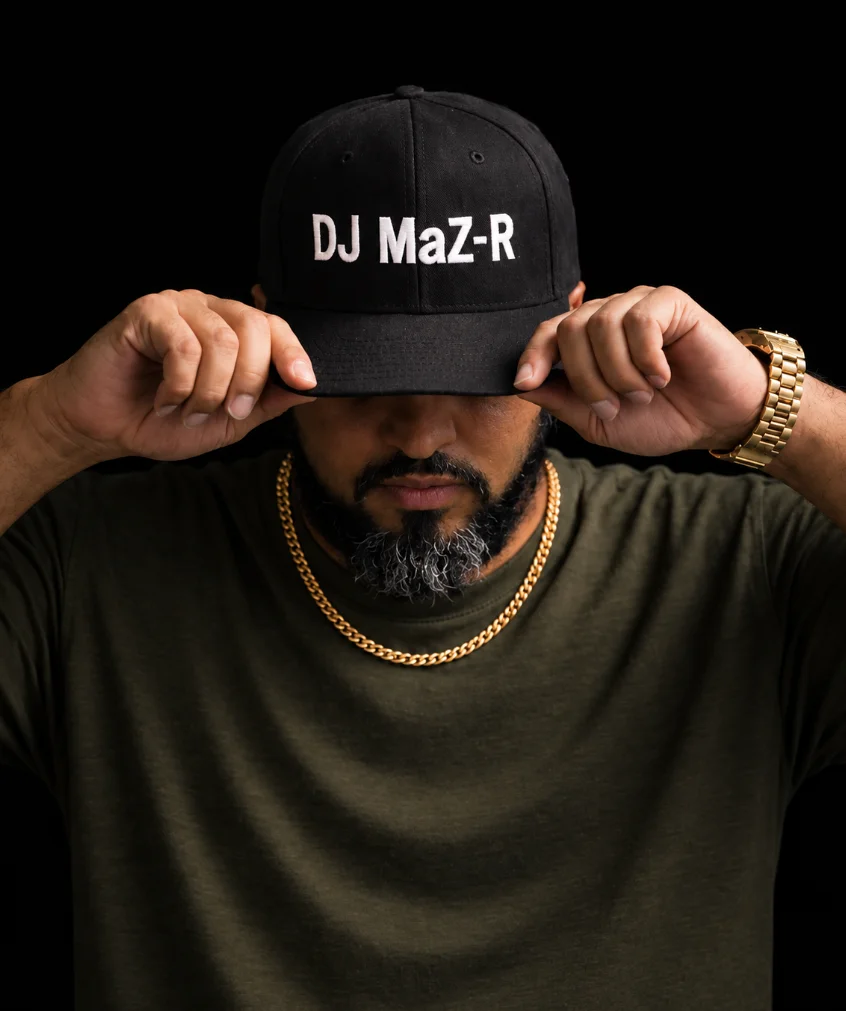 El Bayu Experience owner adjusting a black DJ MaZ-R cap.